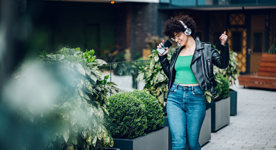 Woman dancing with headphones