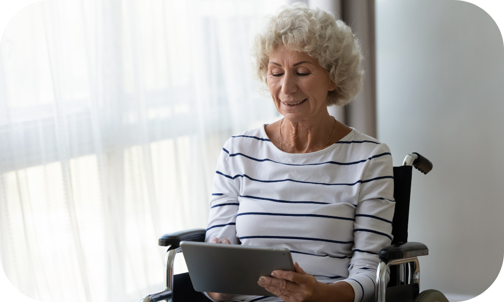 woman interacting with physical therapy app tablet in wheelchair 